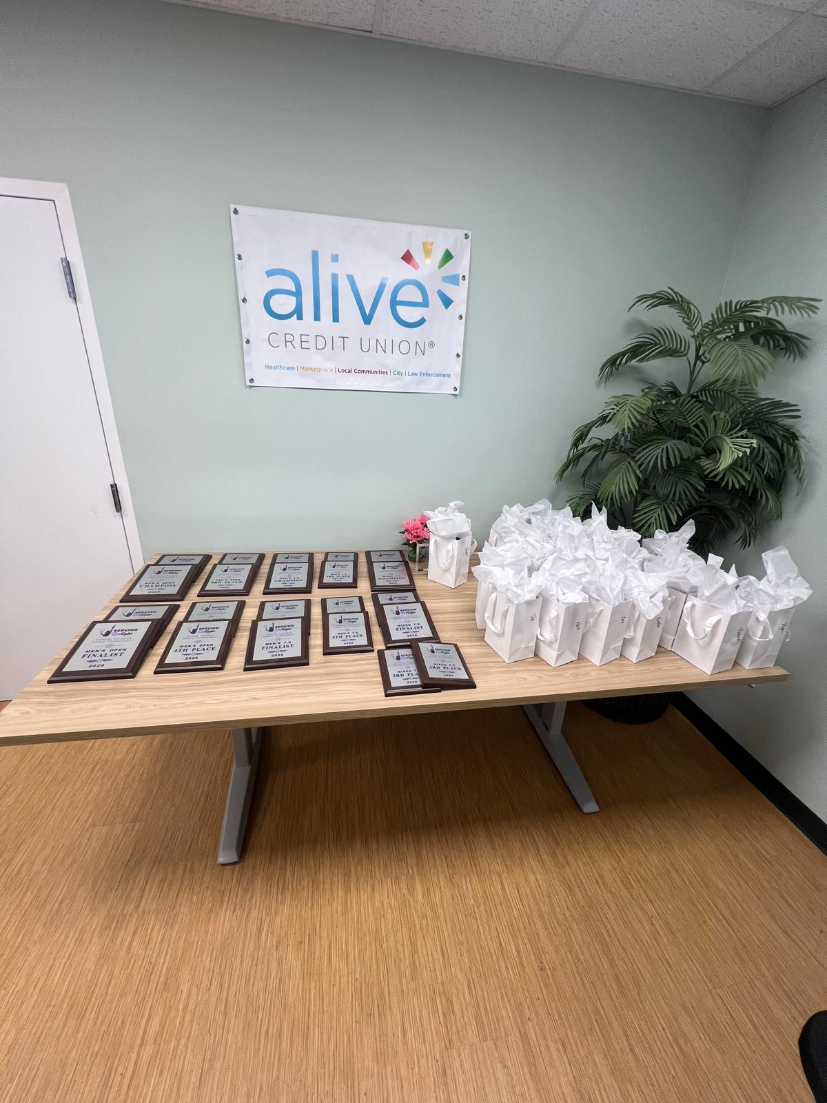 The awards table set with plaques and gift bags